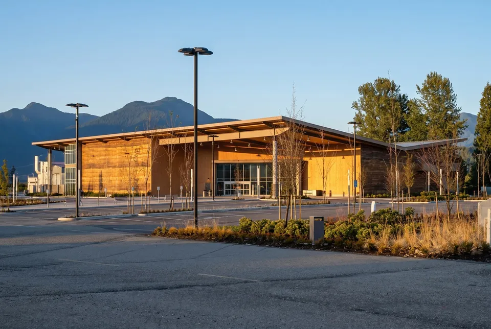 Low timber-clad casino building below the mountains